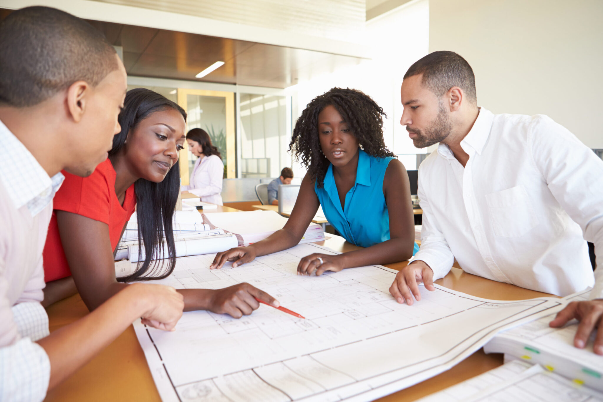 Business team in a meeting discussing scaling operations.