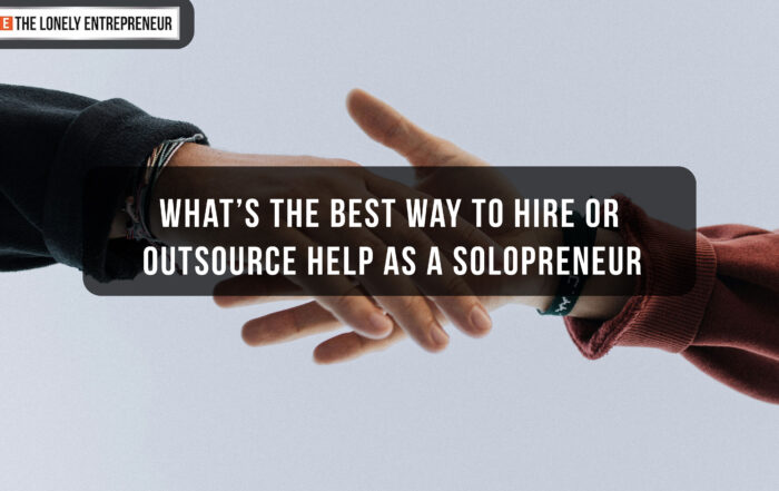 Hands reaching out to one another symbolize trust and collaboration for solopreneurs when outsourcing help